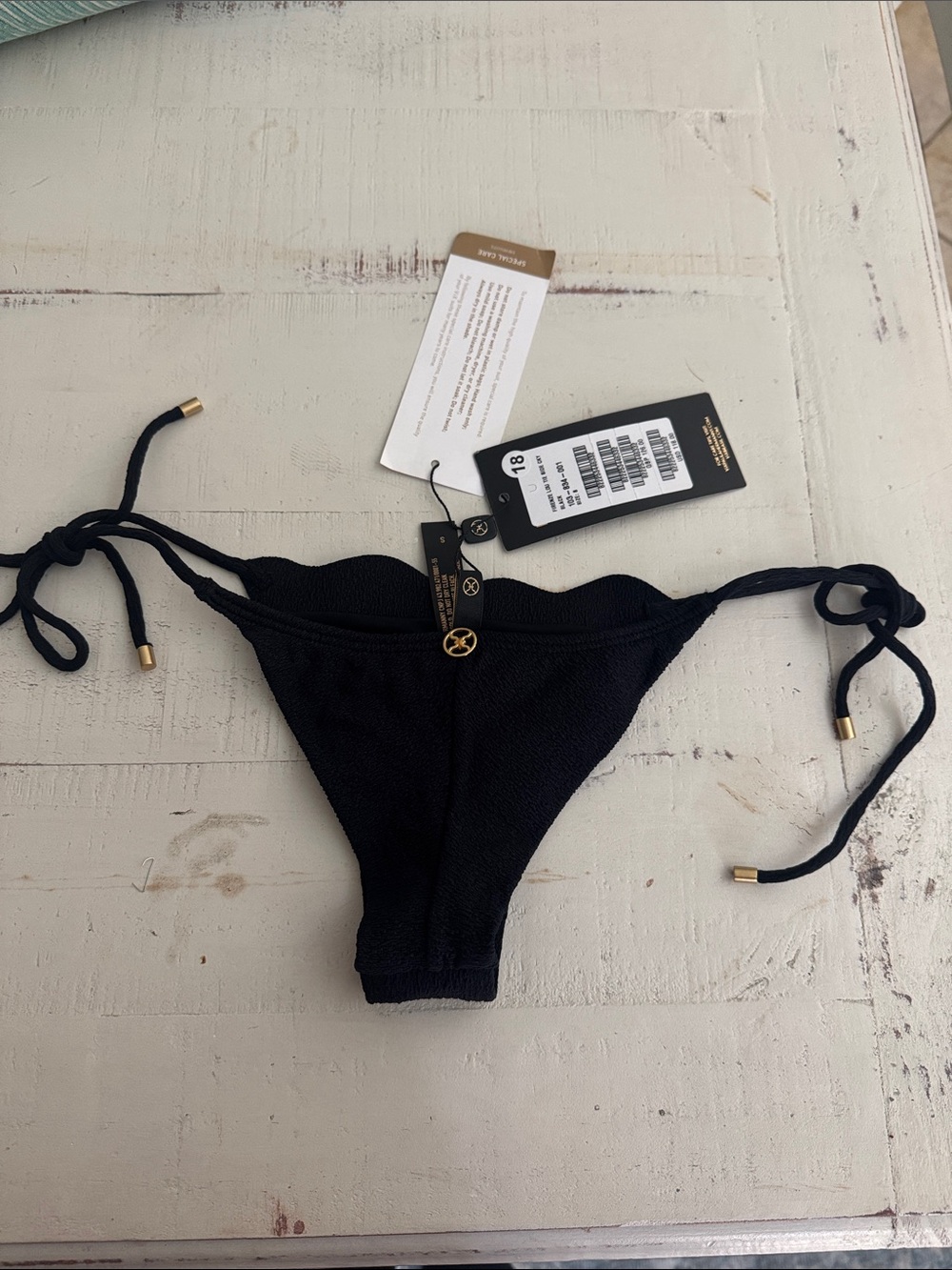 Vix Black Textured Tie-Side Bikini Bottom with Gold Accents